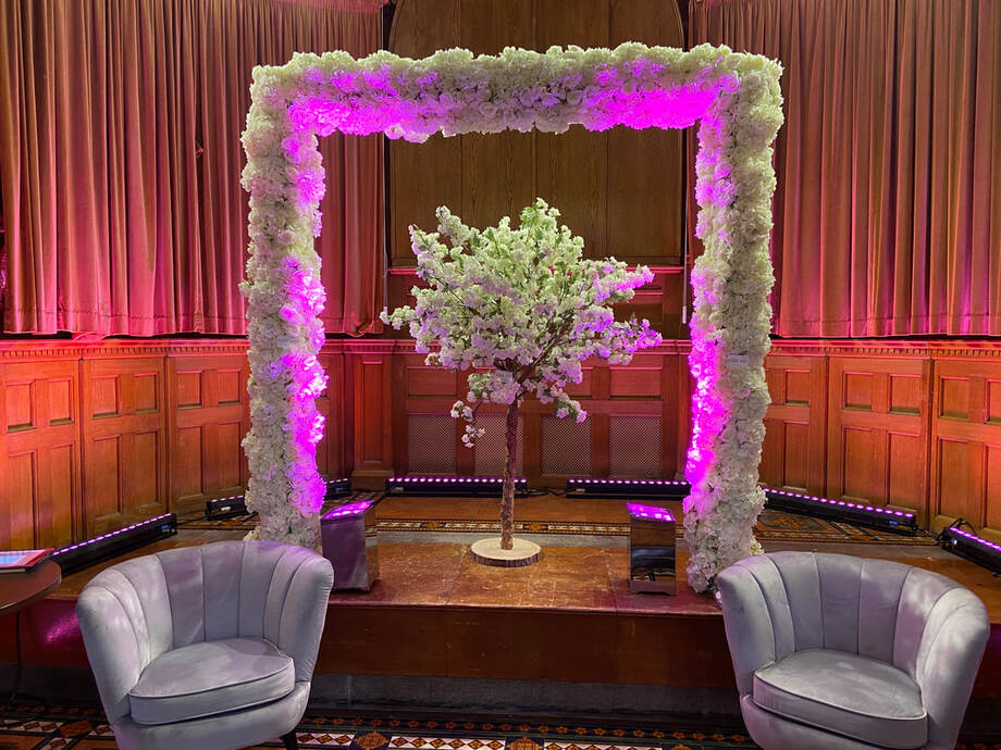 Wedding Arch at St. James Guernsey & suede chairs