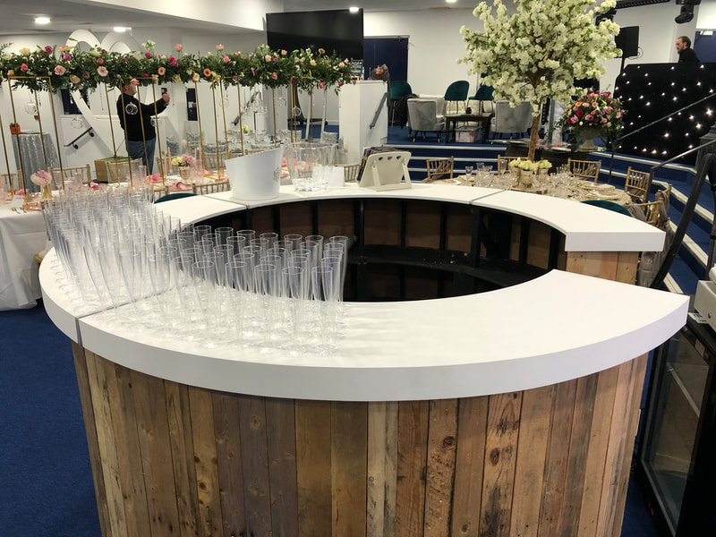 Round rustic bar available from the Joys Events team