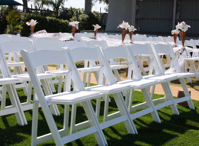 White wimbledon  folding wedding Chairs available from Joys Events team - Guernsey